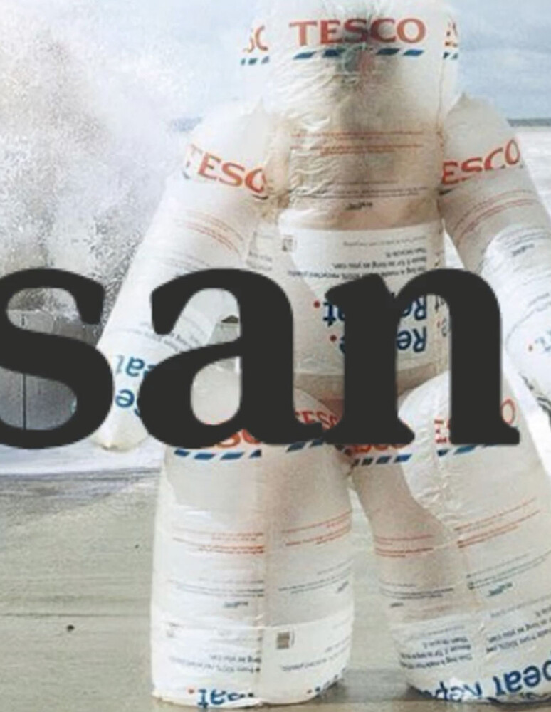 A San Kim design: a faceless inflatable creature made out of Tesco grocery bags, with the name "San" over it.